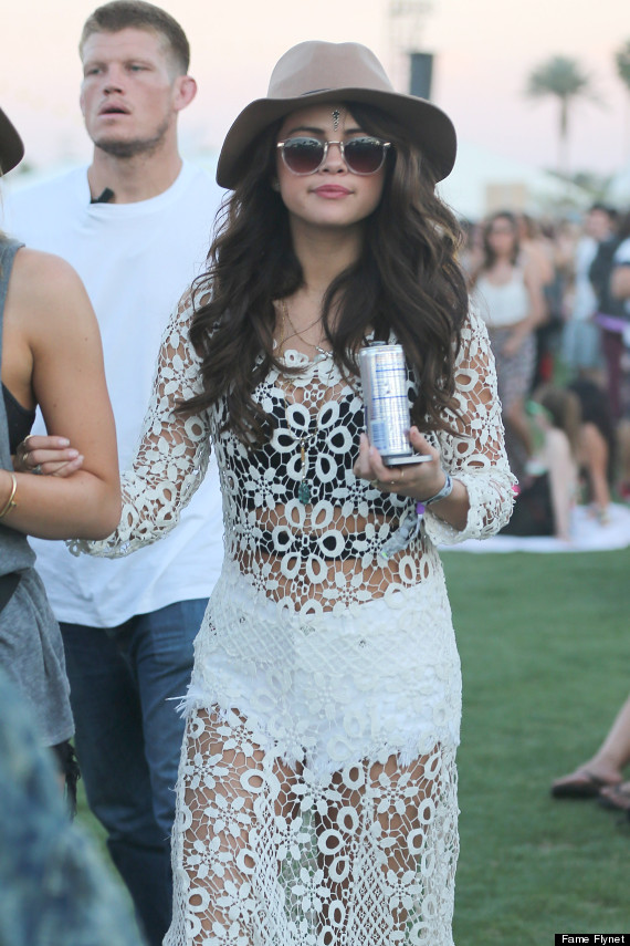 Selena was wearing a fave of mine, her floral patterned see through dress, which she wore over a crop top and white shorts.  The dress definitely screams Coachella.  Another great outfit from Selena!